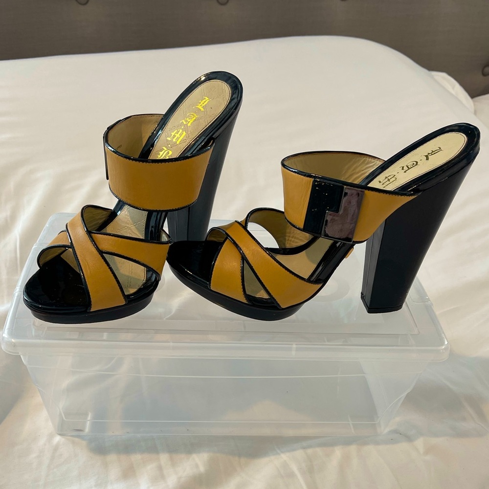 LAMB tan and black patent leather trimmed platform sandals.